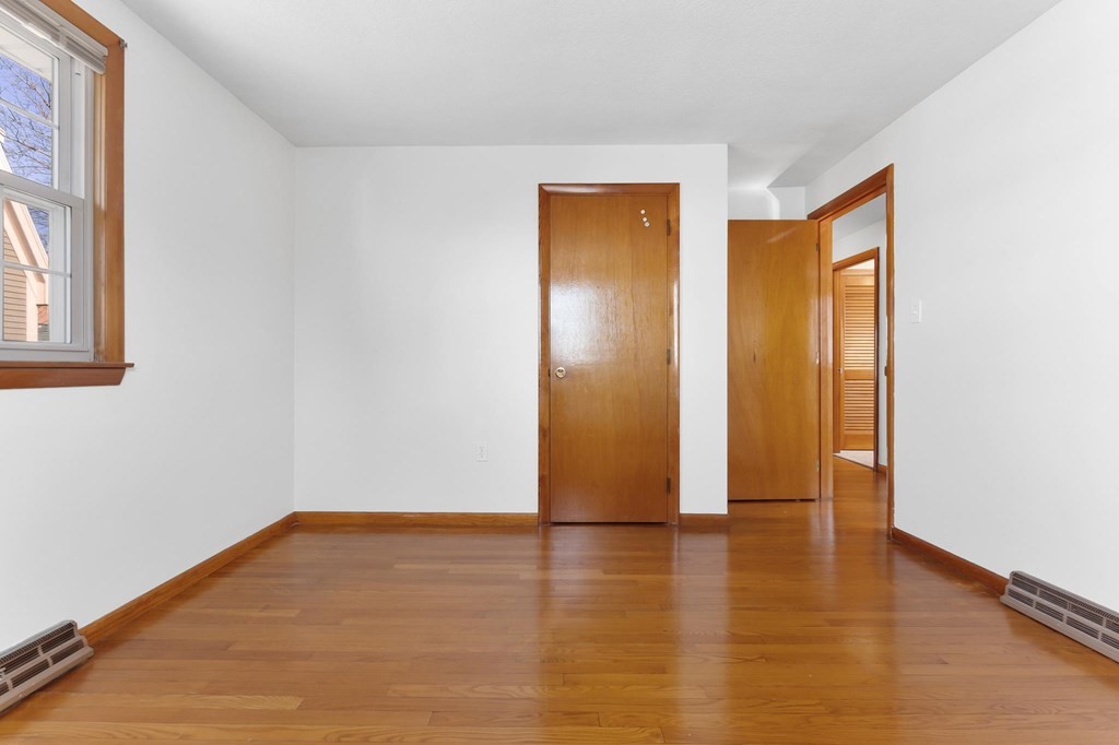 20 Davis Terrace Peabody, MA 01960 - Photo 21 of 25 a view of an empty room with wooden floor and a window