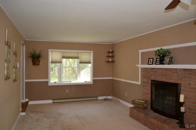 2142 Oak Road Nazareth, PA 18064 - Photo 4 of 19 a view of an empty room with a fireplace and a window