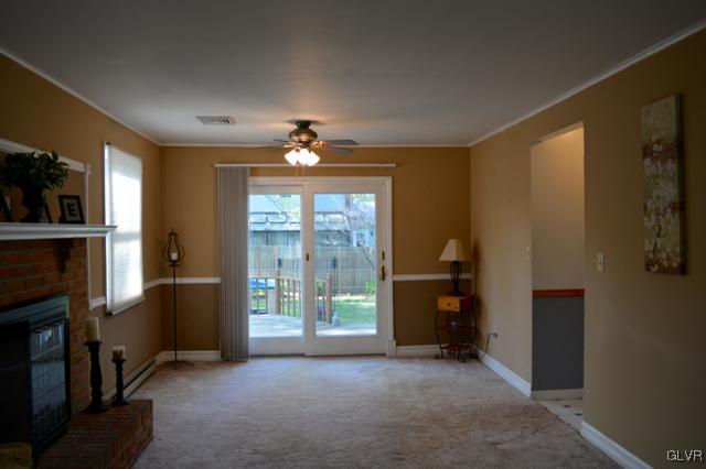 2142 Oak Road Nazareth, PA 18064 - Photo 6 of 19 a view of empty room with floor to ceiling window and fireplace