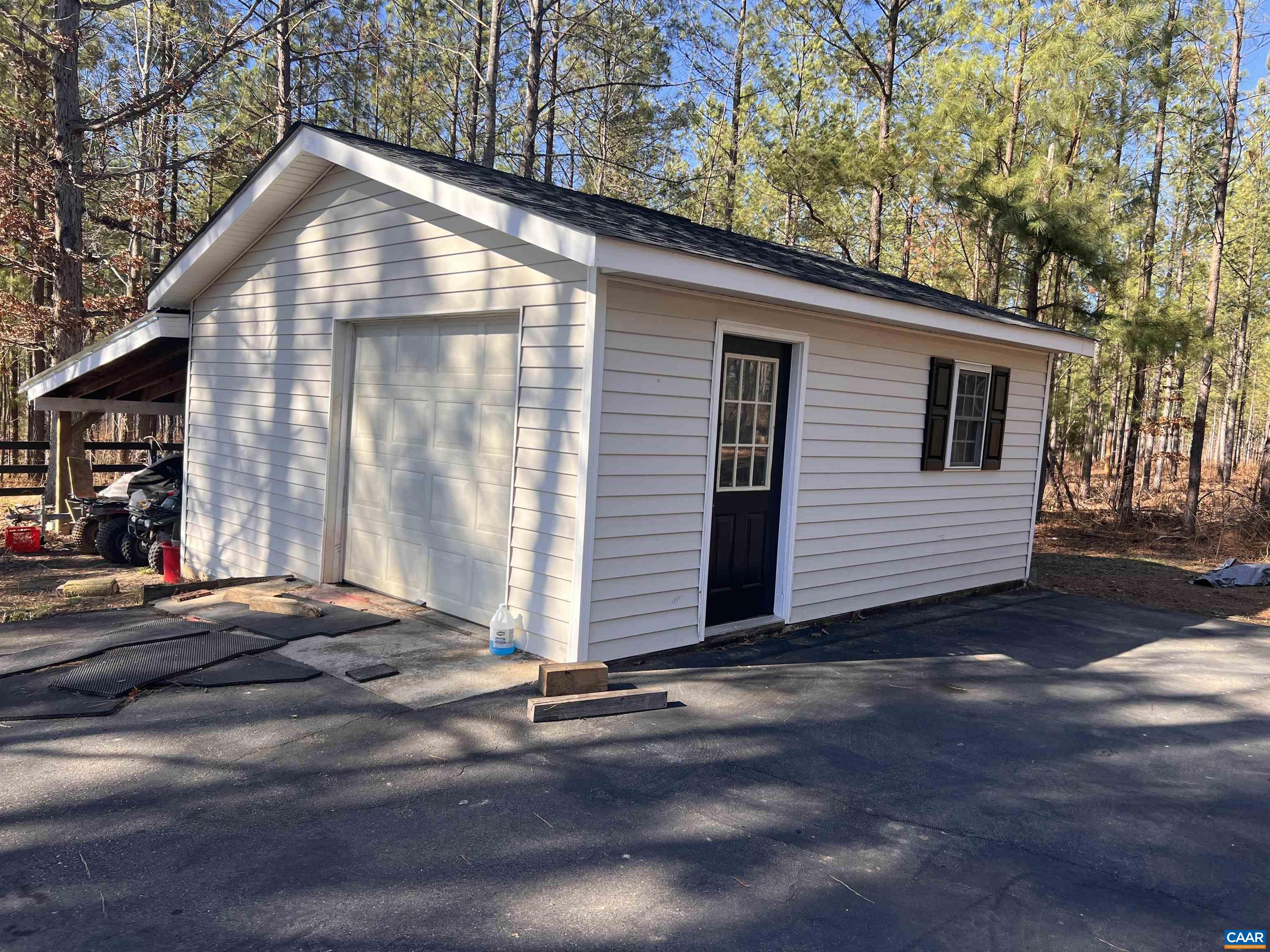 651 Kents Mill Road Louisa, VA 23093 - Photo 14 of 55 a front view of a house with a garage