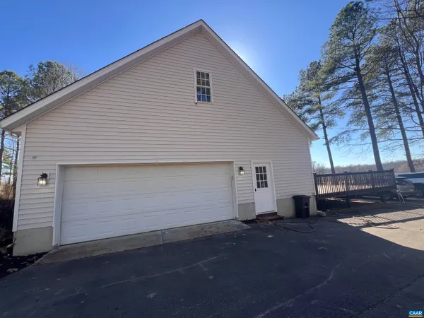 a view of staircase with white walls