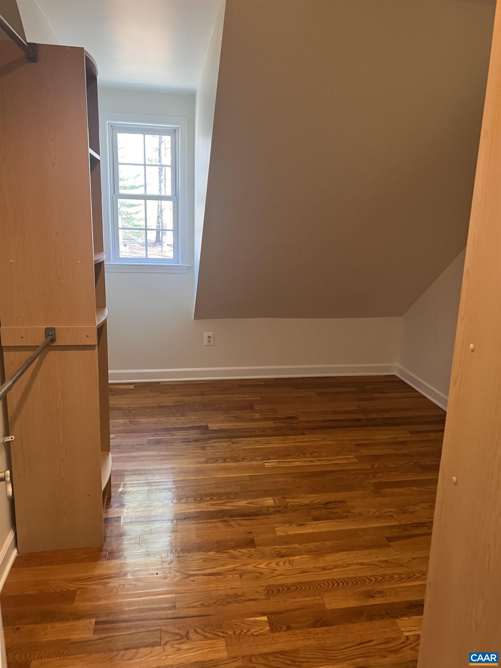 651 Kents Mill Road Louisa, VA 23093 - Photo 22 of 55 a view of an empty room with wooden floor and a window