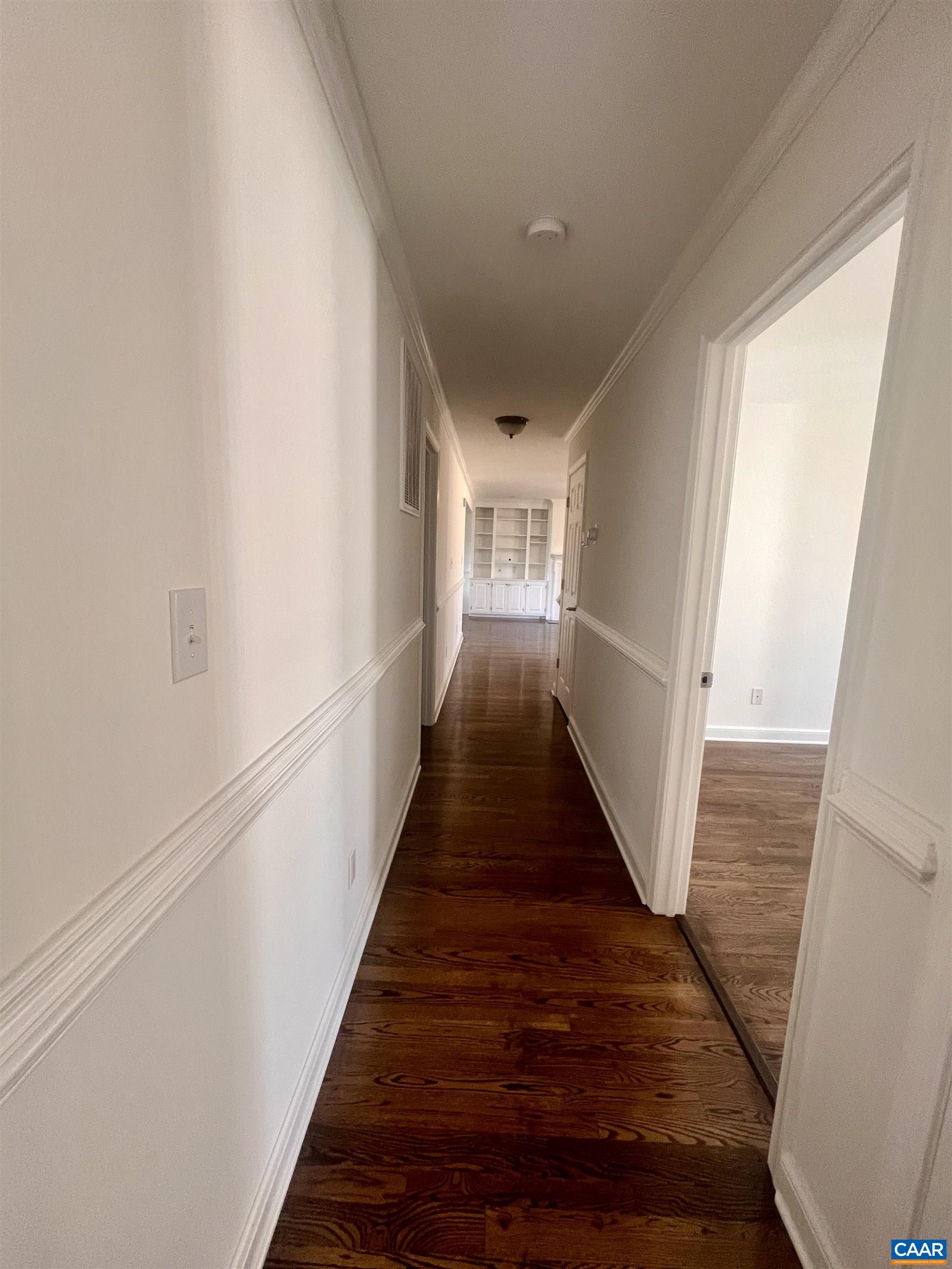 651 Kents Mill Road Louisa, VA 23093 - Photo 40 of 55 a view of a hallway with wooden floor and staircase