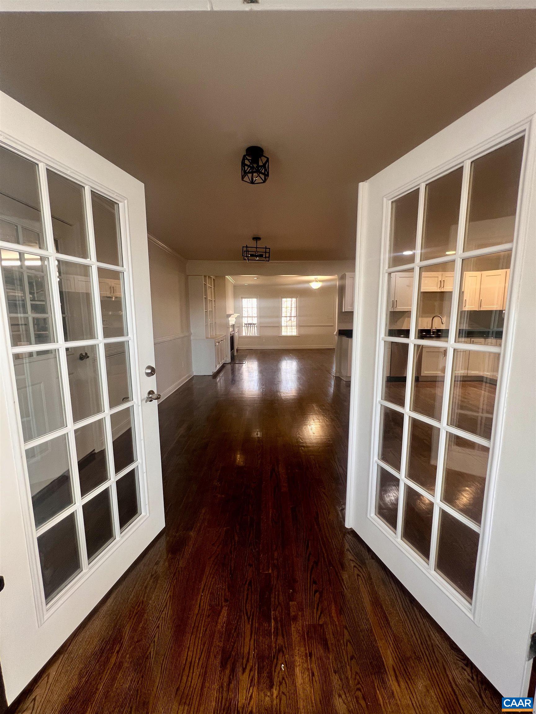651 Kents Mill Road Louisa, VA 23093 - Photo 42 of 55 a view of an empty room with wooden floor and windows