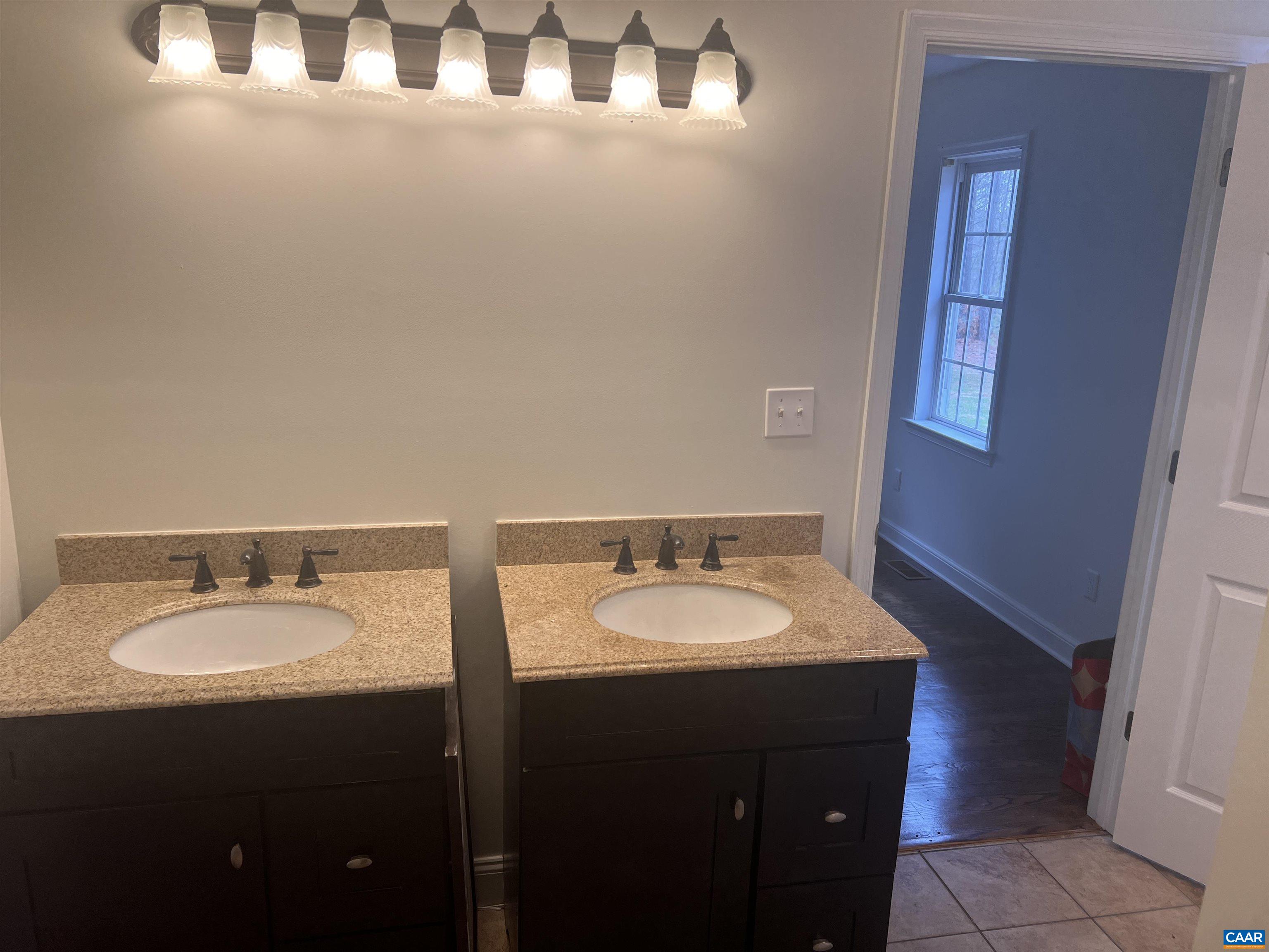 651 Kents Mill Road Louisa, VA 23093 - Photo 53 of 55 a bathroom with a sink and a mirror