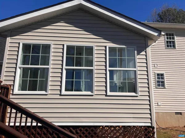 a view of wooden floor with windows