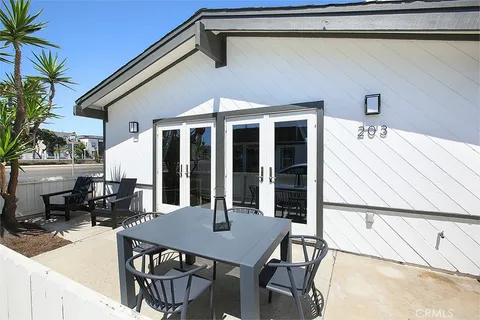 a view of a patio with a table and chairs