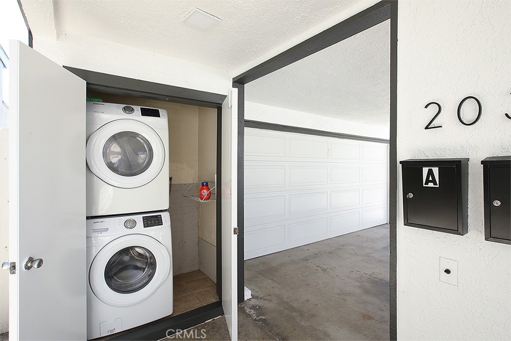 203 Cedar Street, Unit A & B Newport Beach, CA 92663 - Photo 26 of 32 a utility room with dryer and washer