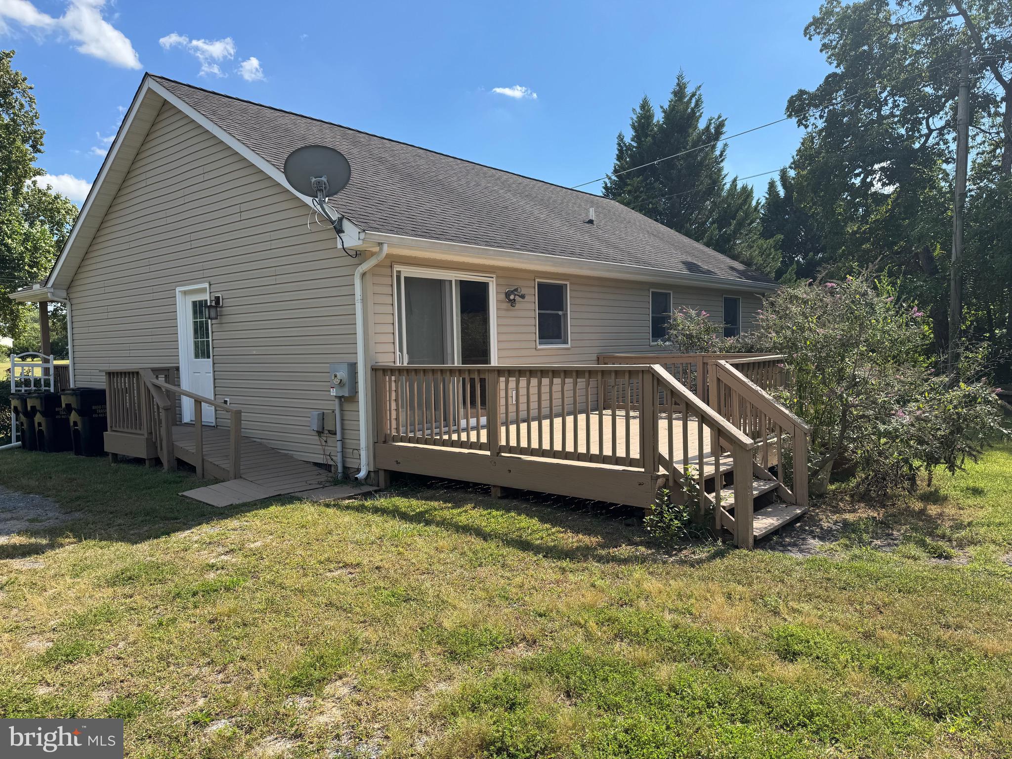 113 Boyce Mill Road Greensboro, MD 21639 - Photo 15 of 23 a view of a house with a yard and deck