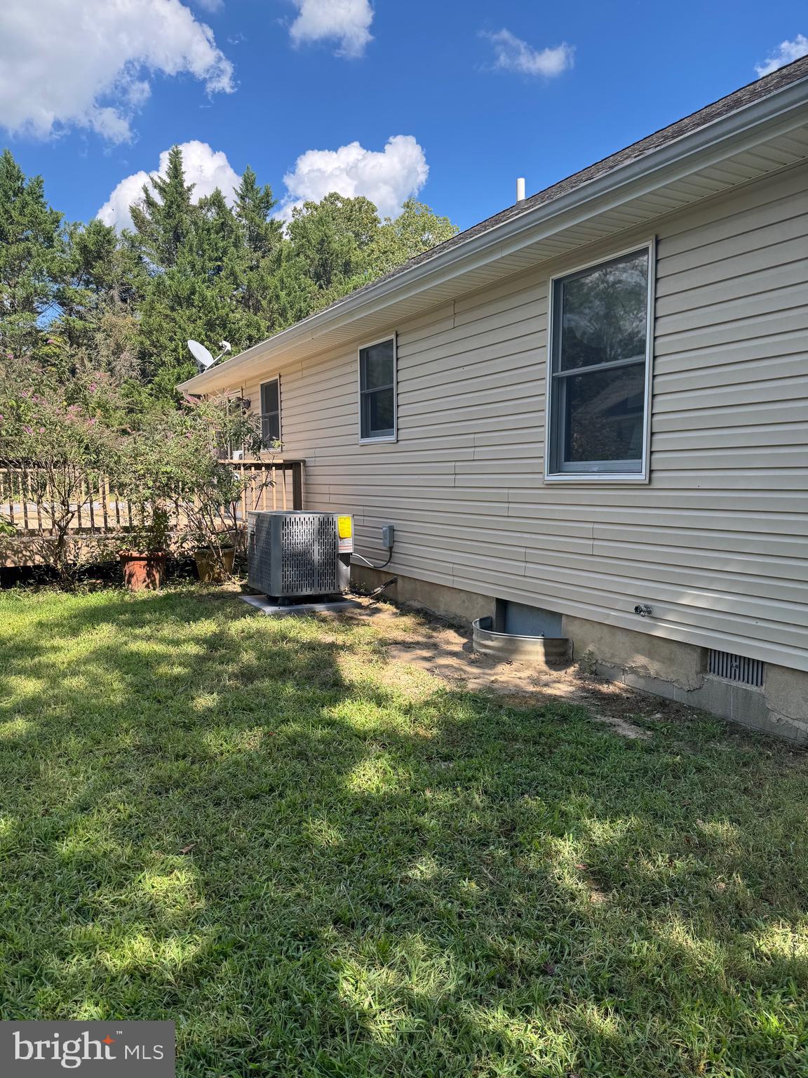 113 Boyce Mill Road Greensboro, MD 21639 - Photo 16 of 23 a backyard of a house with garden and outdoor seating
