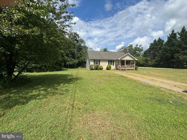 a view of a house with a big yard