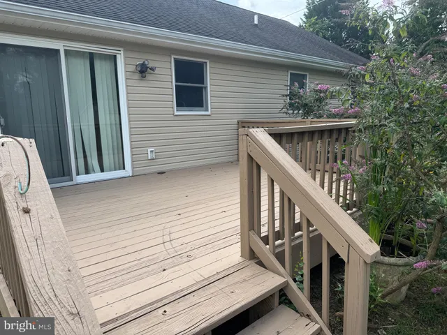 a view of deck with wooden floor and stairs
