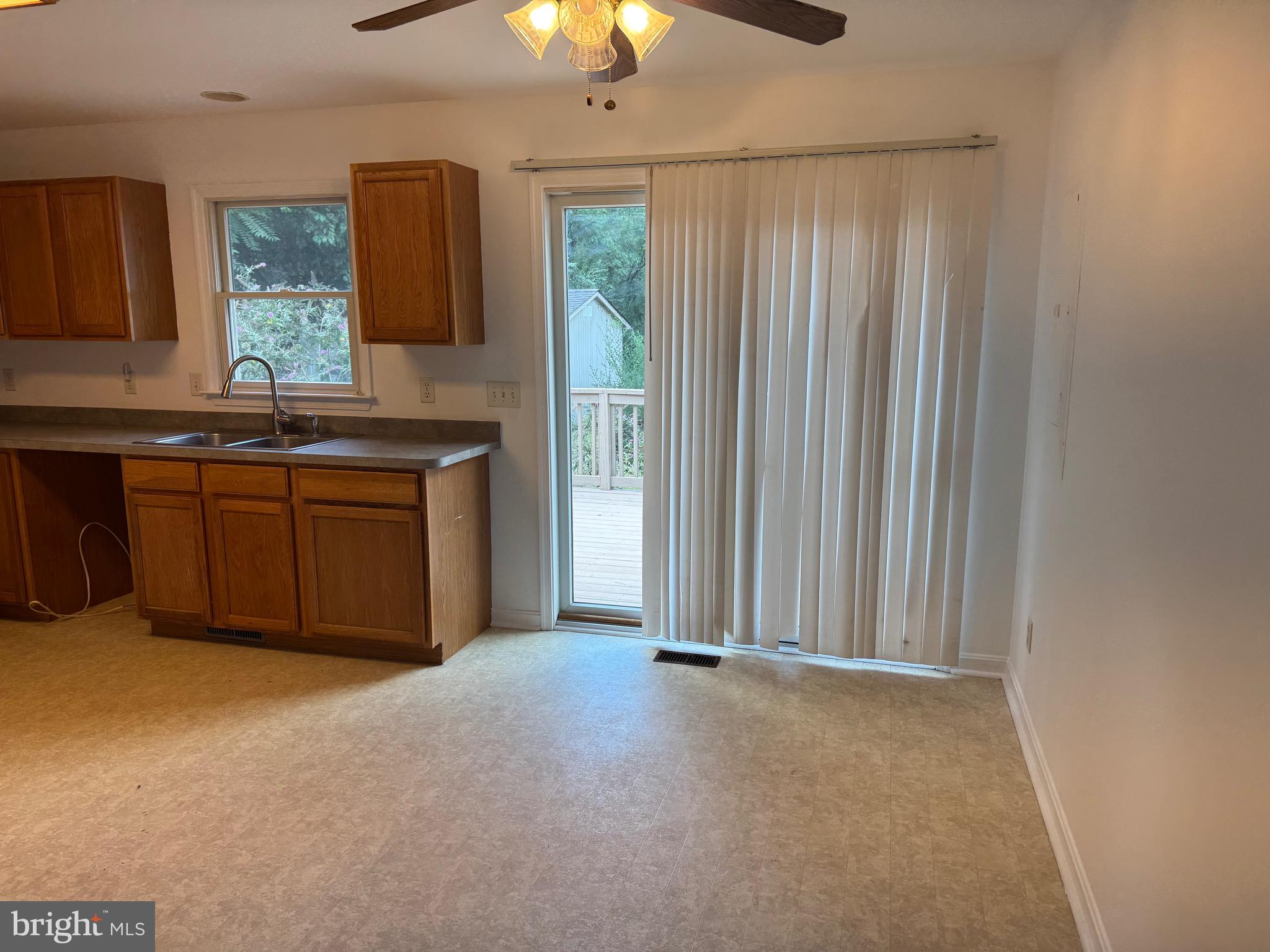 113 Boyce Mill Road Greensboro, MD 21639 - Photo 3 of 23 a view of a kitchen with granite countertop cabinets and a sink