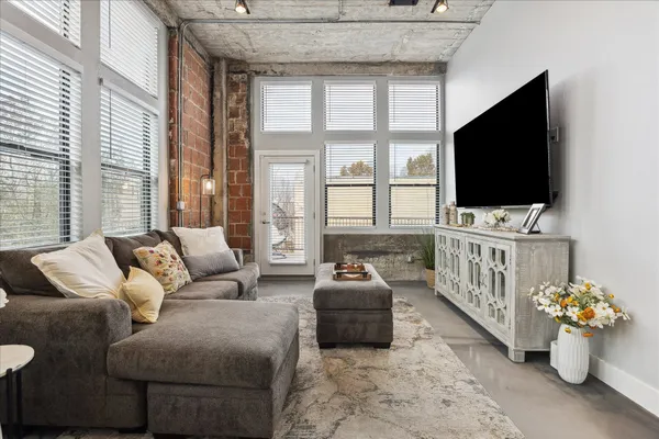 a living room with furniture and a flat screen tv