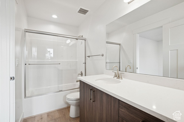 1615 North Angel Street, Unit H Layton, UT 84041 - Photo 30 of 55 Bathroom featuring light wood-type flooring, shower / bath combination with glass door, vanity, and recessed lighting