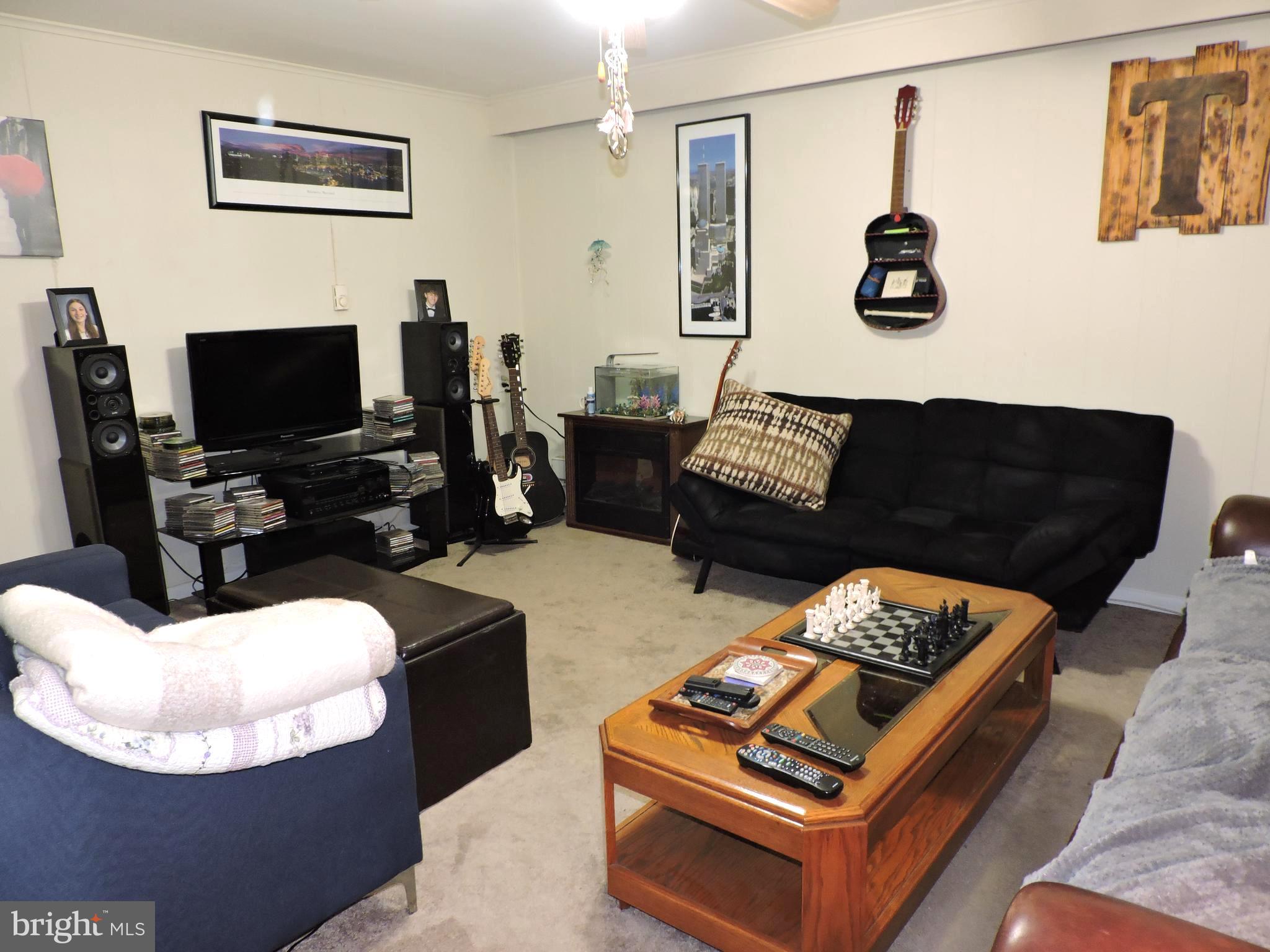 8470 Bussenius Road Pasadena, MD 21122 - Photo 21 of 29 Lower living room