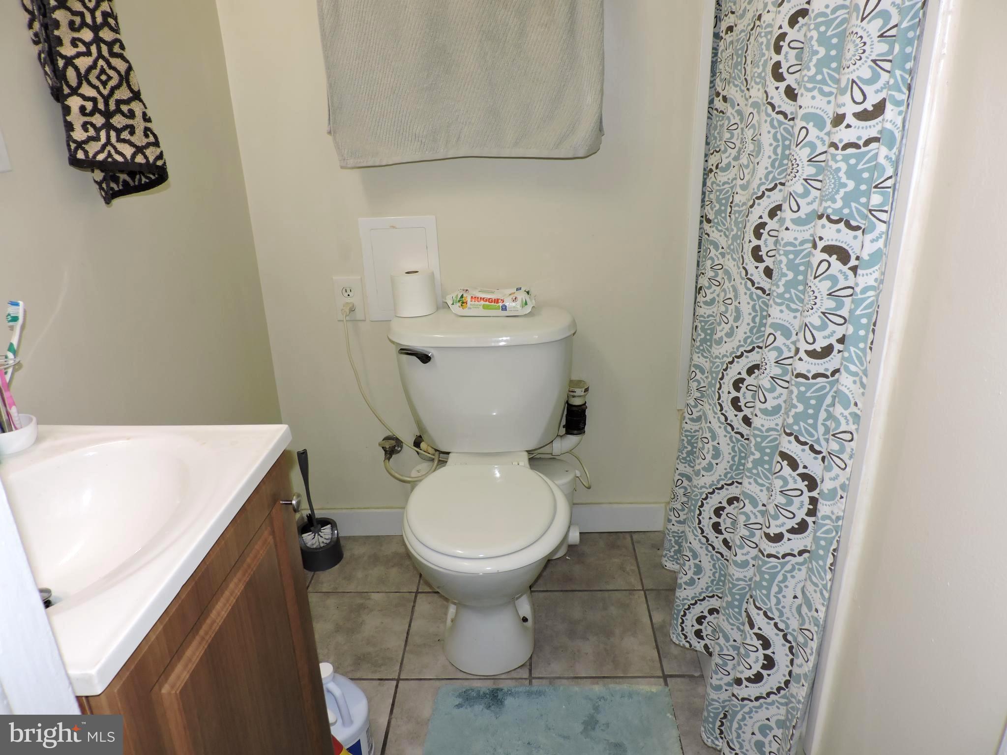 8470 Bussenius Road Pasadena, MD 21122 - Photo 26 of 29 Lower full bath