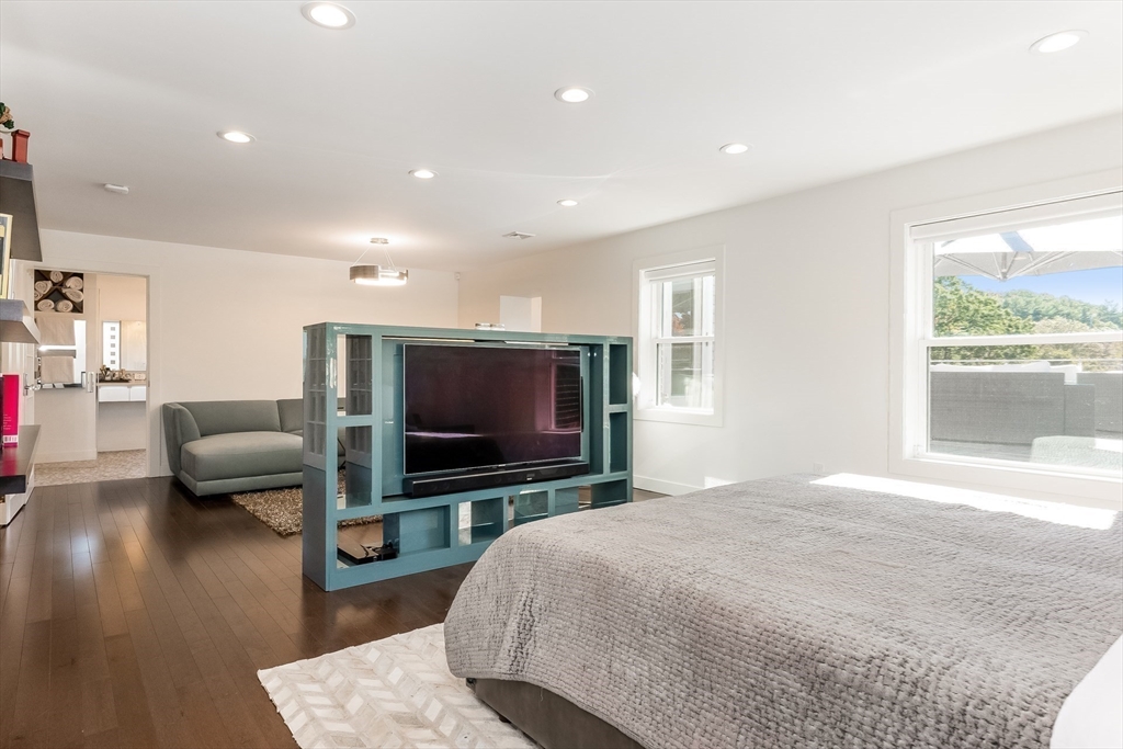 2-4 Evergreen Avenue Newton, MA 02466 - Photo 23 of 41 a bedroom with furniture and a flat screen tv