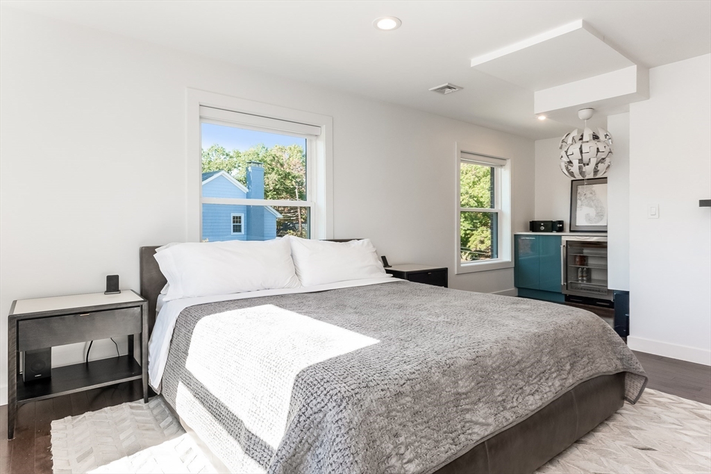 2-4 Evergreen Avenue Newton, MA 02466 - Photo 24 of 41 a bedroom with a large bed and a window