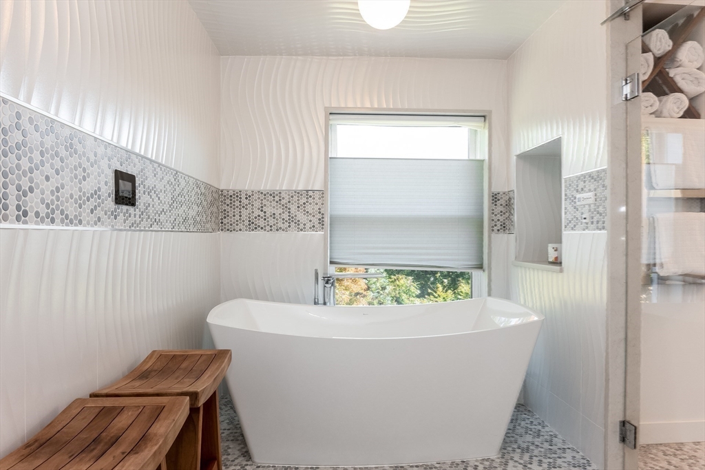 2-4 Evergreen Avenue Newton, MA 02466 - Photo 25 of 41 a white bath tub sitting in a bathroom