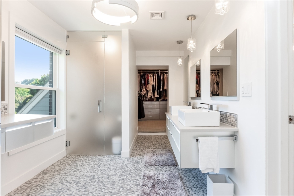 2-4 Evergreen Avenue Newton, MA 02466 - Photo 27 of 41 a bathroom with a sink a toilet and shower