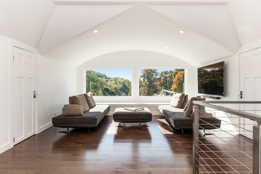 2-4 Evergreen Avenue Newton, MA 02466 - Photo 31 of 41 a living room with furniture and a large window