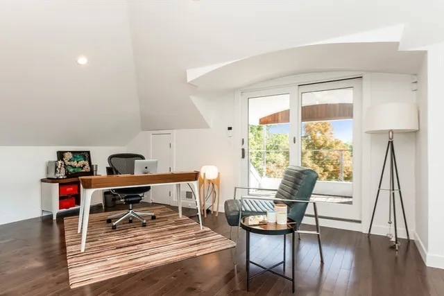 a open kitchen with stainless steel appliances granite countertop a sink dishwasher stove and cabinets with wooden floor