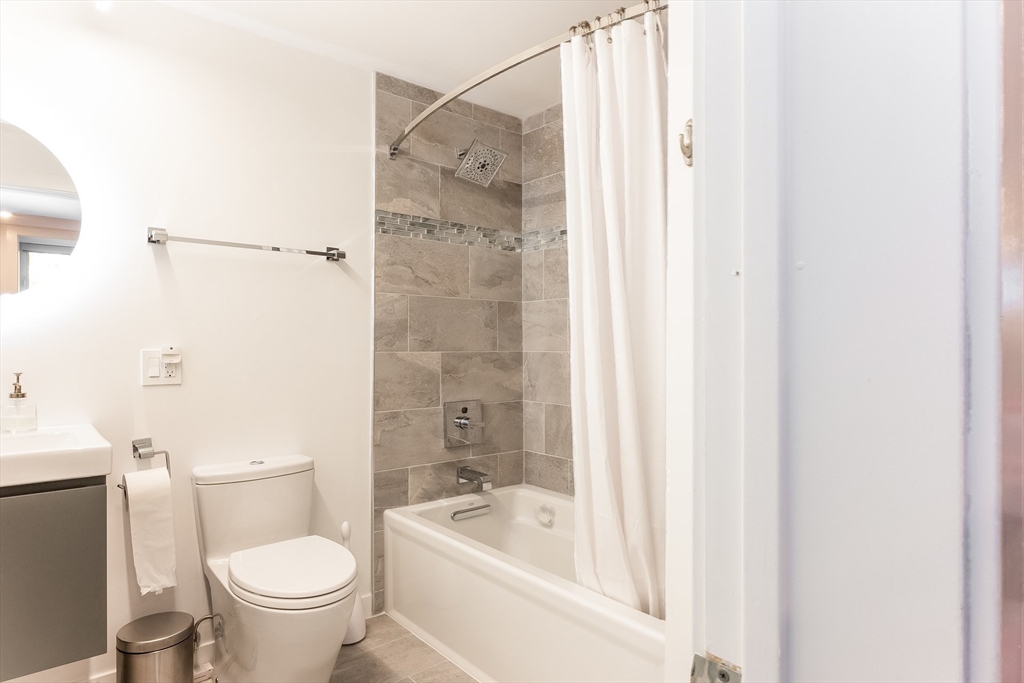 2-4 Evergreen Avenue Newton, MA 02466 - Photo 36 of 41 a bathroom with a toilet a sink and bathtub