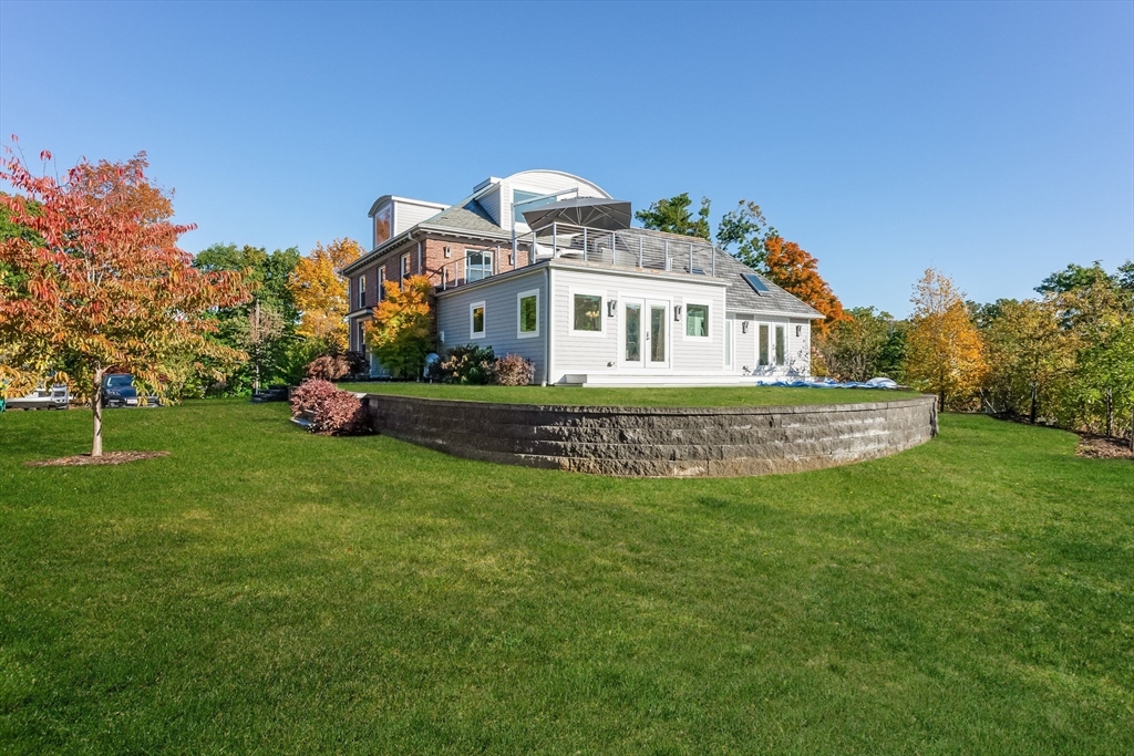 2-4 Evergreen Avenue Newton, MA 02466 - Photo 4 of 41 a front view of a house with a garden