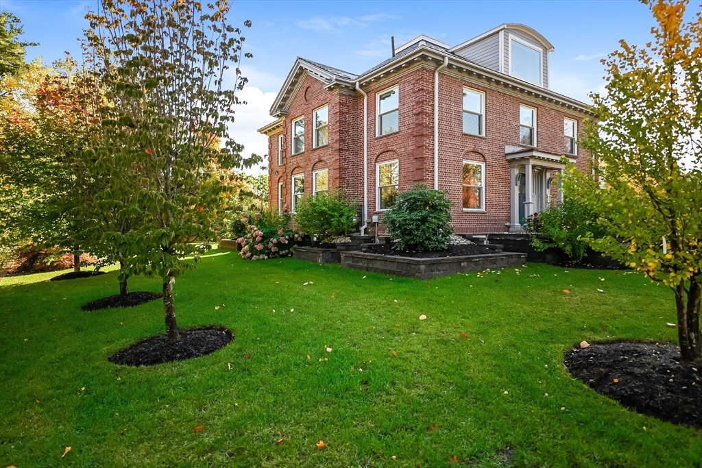 2-4 Evergreen Avenue Newton, MA 02466 - Photo 5 of 41 a front view of a house with a yard