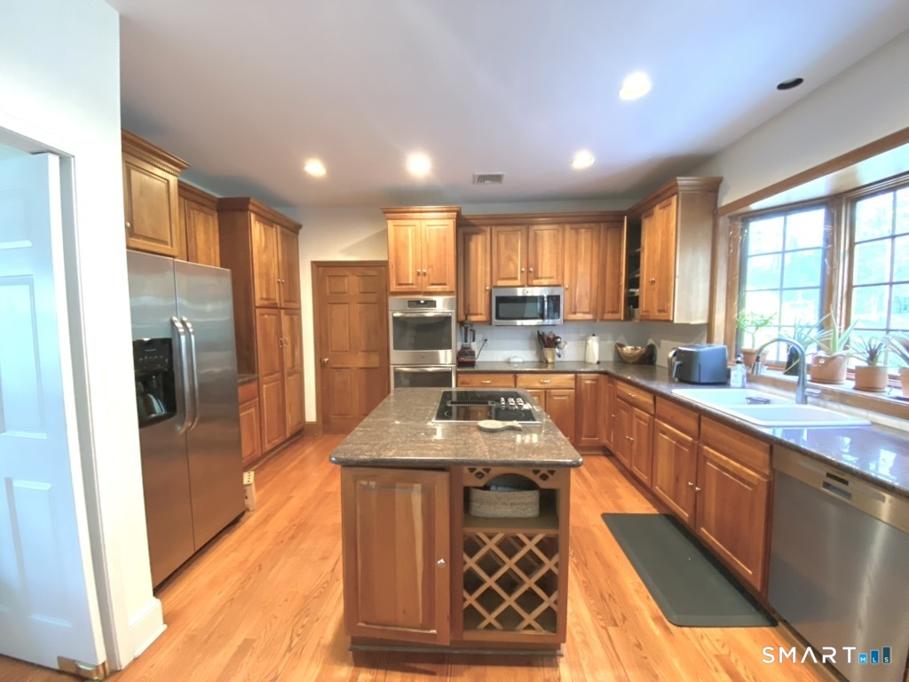 12 Carriage Hill Road Woodbridge, CT 06525 - Photo 7 of 24 a large kitchen with lots of counter space