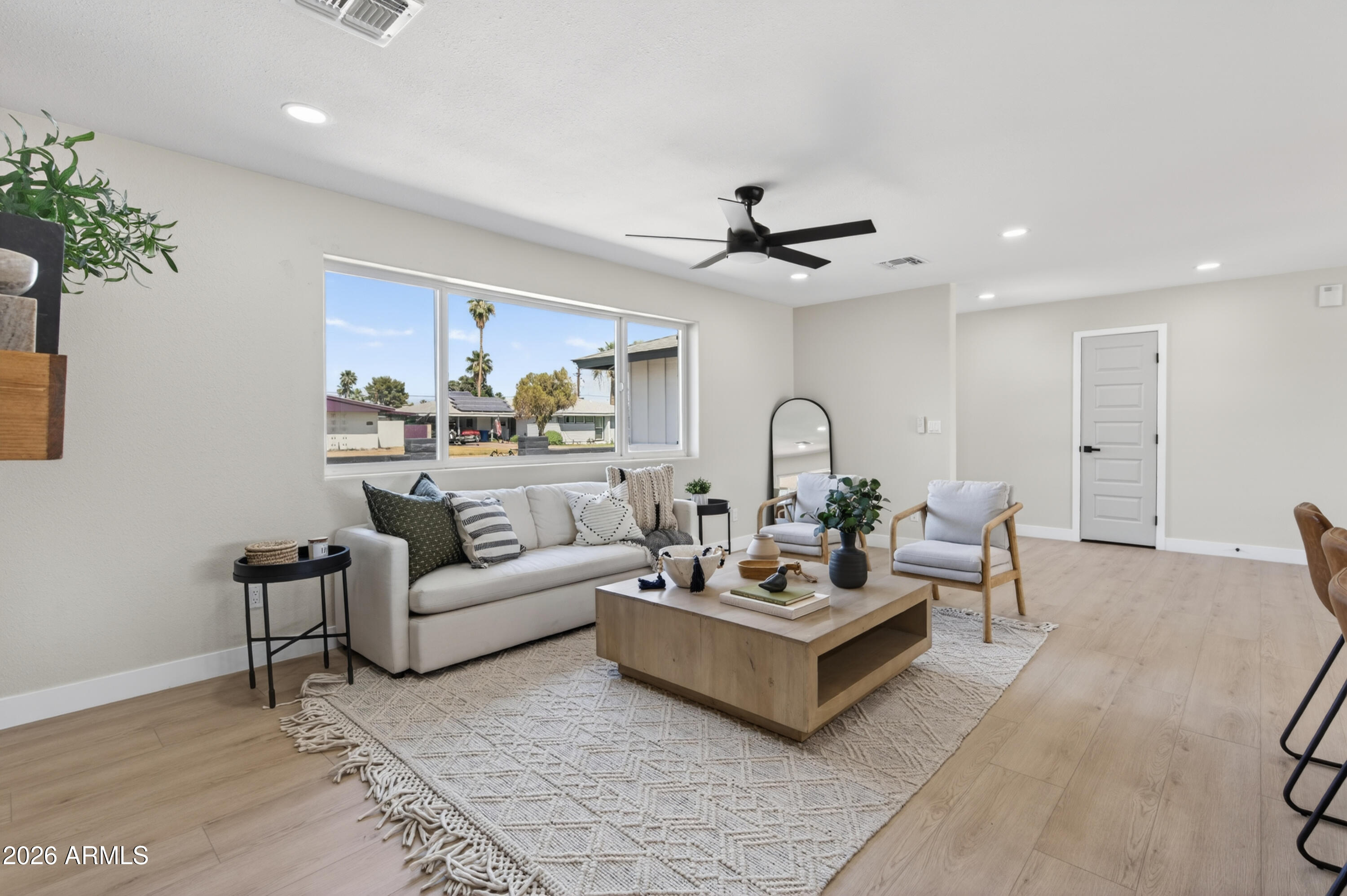 3422 South Terrace Road Tempe, AZ 85282 - Photo 13 of 43 a living room with furniture a chandelier and a rug