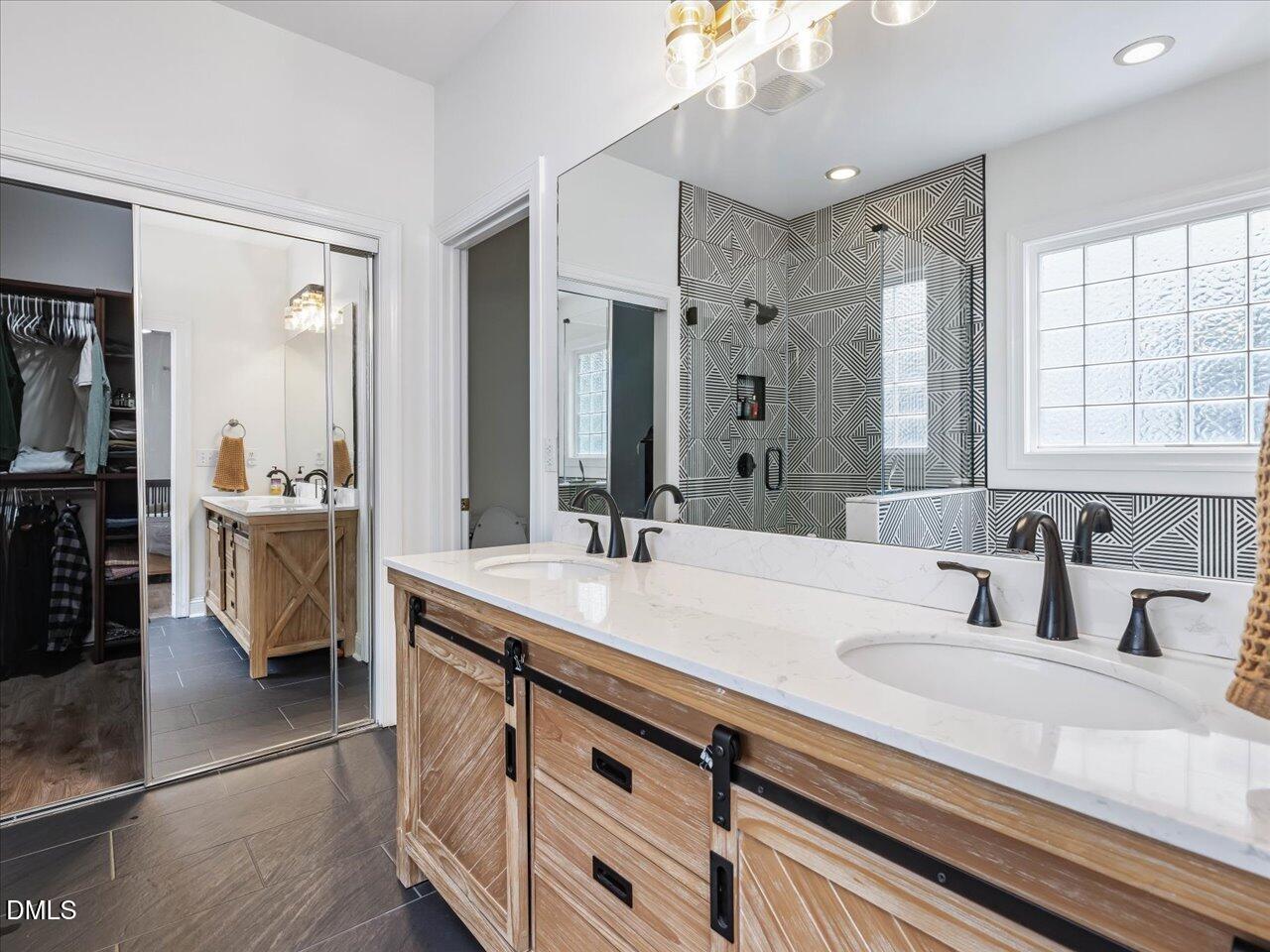 1311 Pendula Path Apex, NC 27502 - Photo 15 of 30 a bathroom with a sink double vanity and a mirror