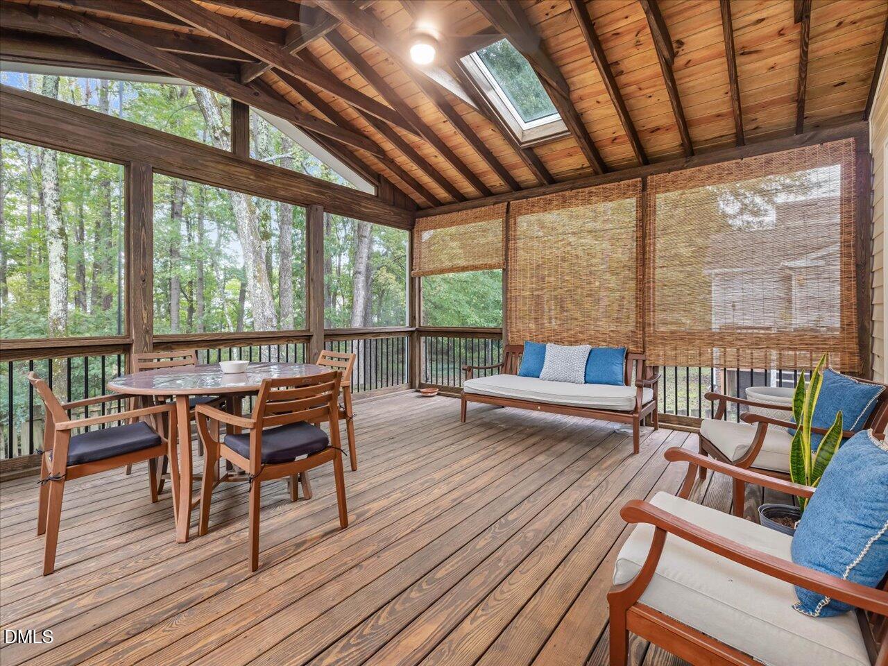 1311 Pendula Path Apex, NC 27502 - Photo 2 of 30 a view of a dining room with furniture large windows and wooden floor