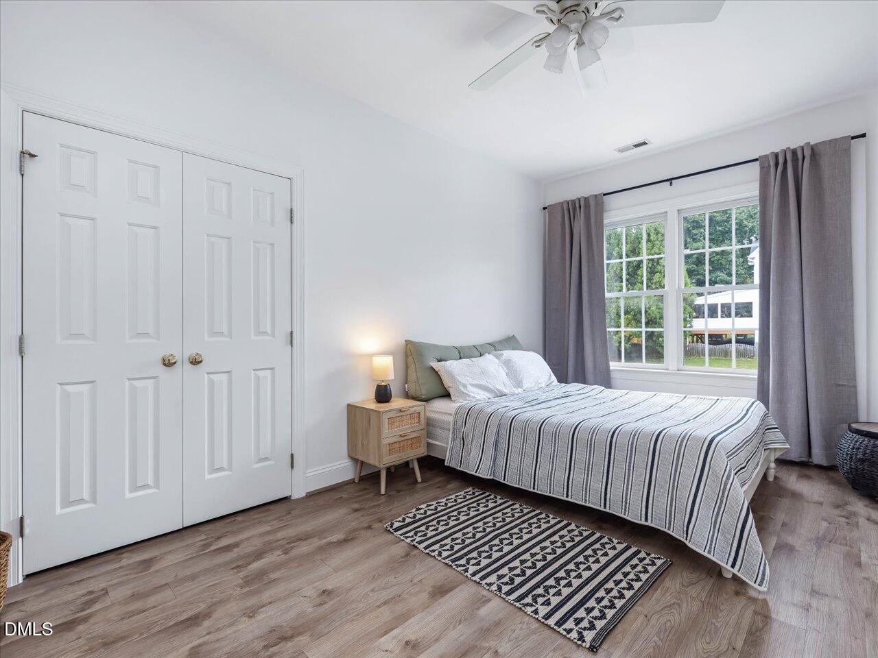 1311 Pendula Path Apex, NC 27502 - Photo 23 of 30 a bedroom with a bed and a window