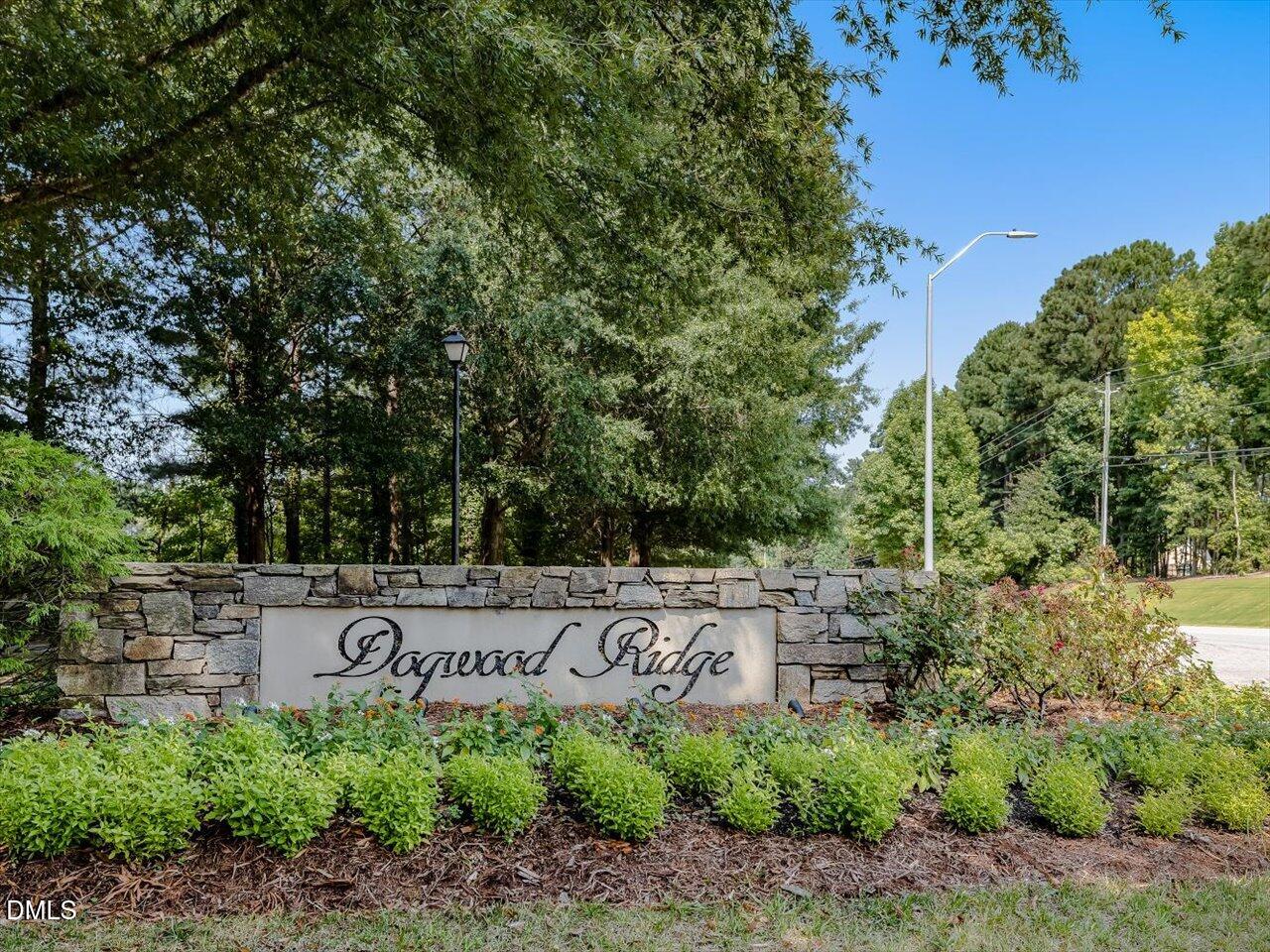 1311 Pendula Path Apex, NC 27502 - Photo 24 of 30 a view of a street sign under a large tree