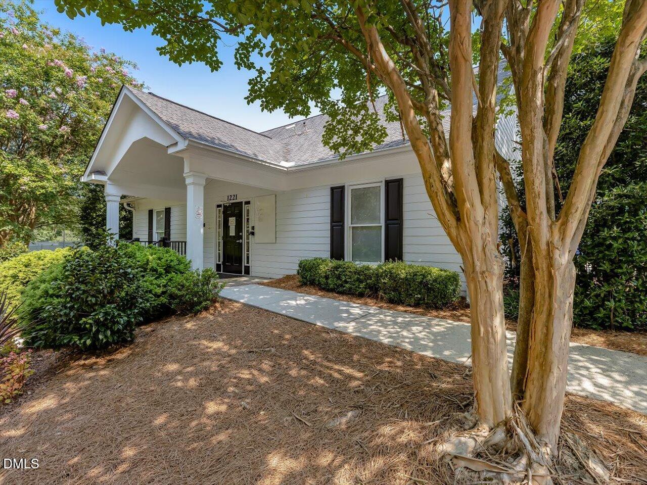 1311 Pendula Path Apex, NC 27502 - Photo 26 of 30 a front view of a house with a tree