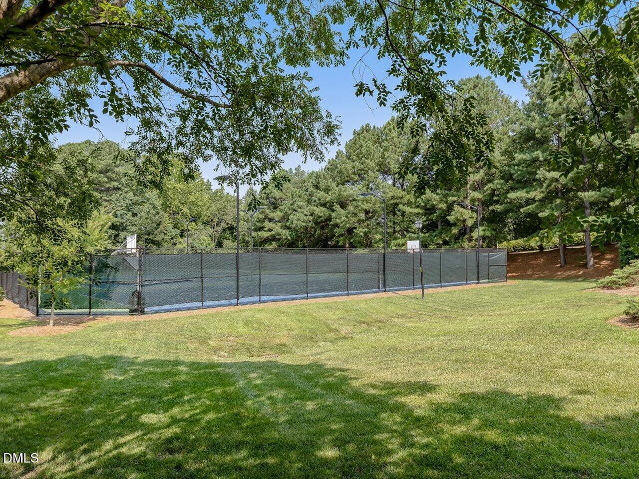 1311 Pendula Path Apex, NC 27502 - Photo 28 of 30 a swimming pool with trees in the background