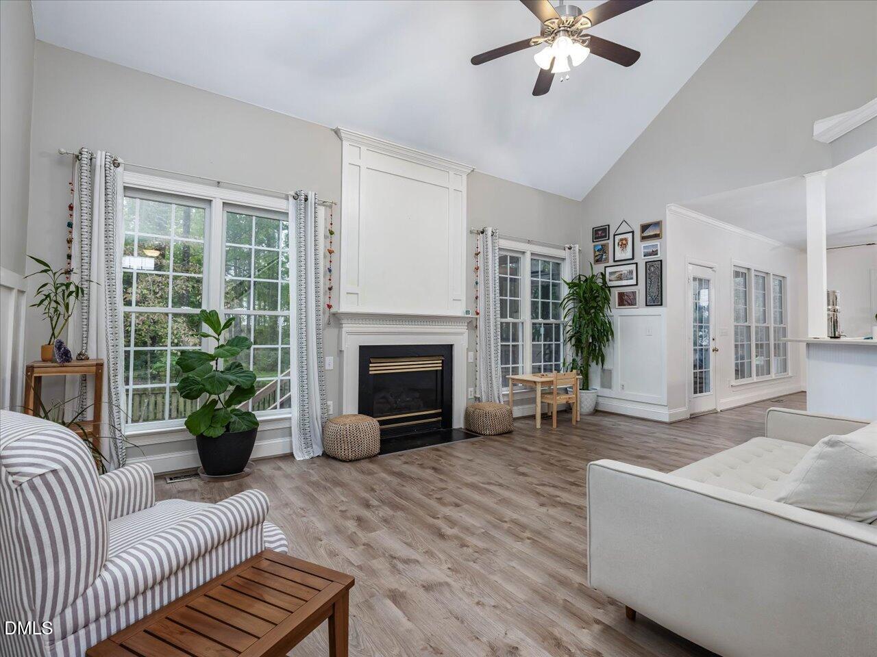 1311 Pendula Path Apex, NC 27502 - Photo 7 of 30 a living room with furniture and a fireplace