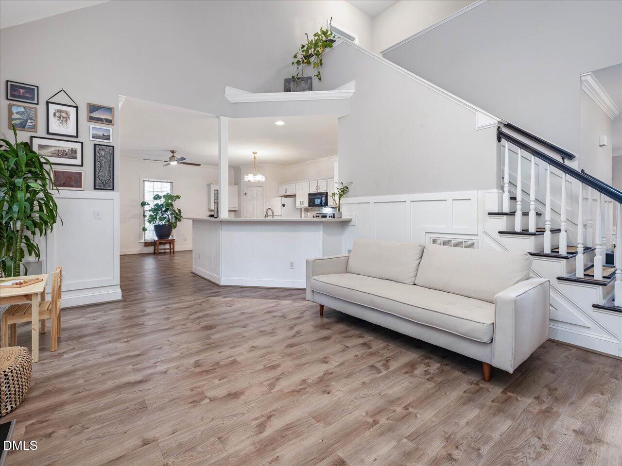 1311 Pendula Path Apex, NC 27502 - Photo 10 of 30 a living room with furniture and wooden floor
