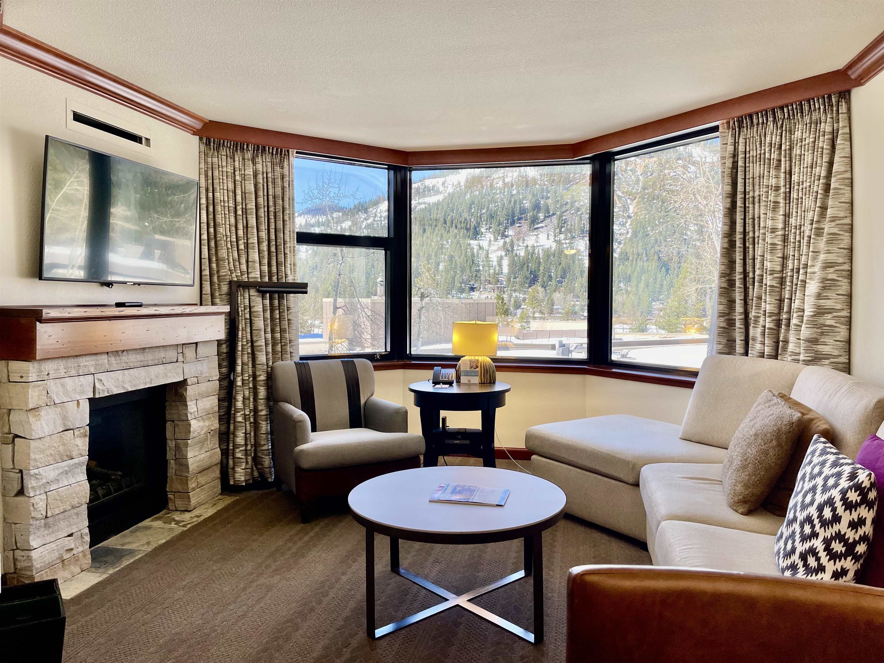 a living room with furniture and a large window