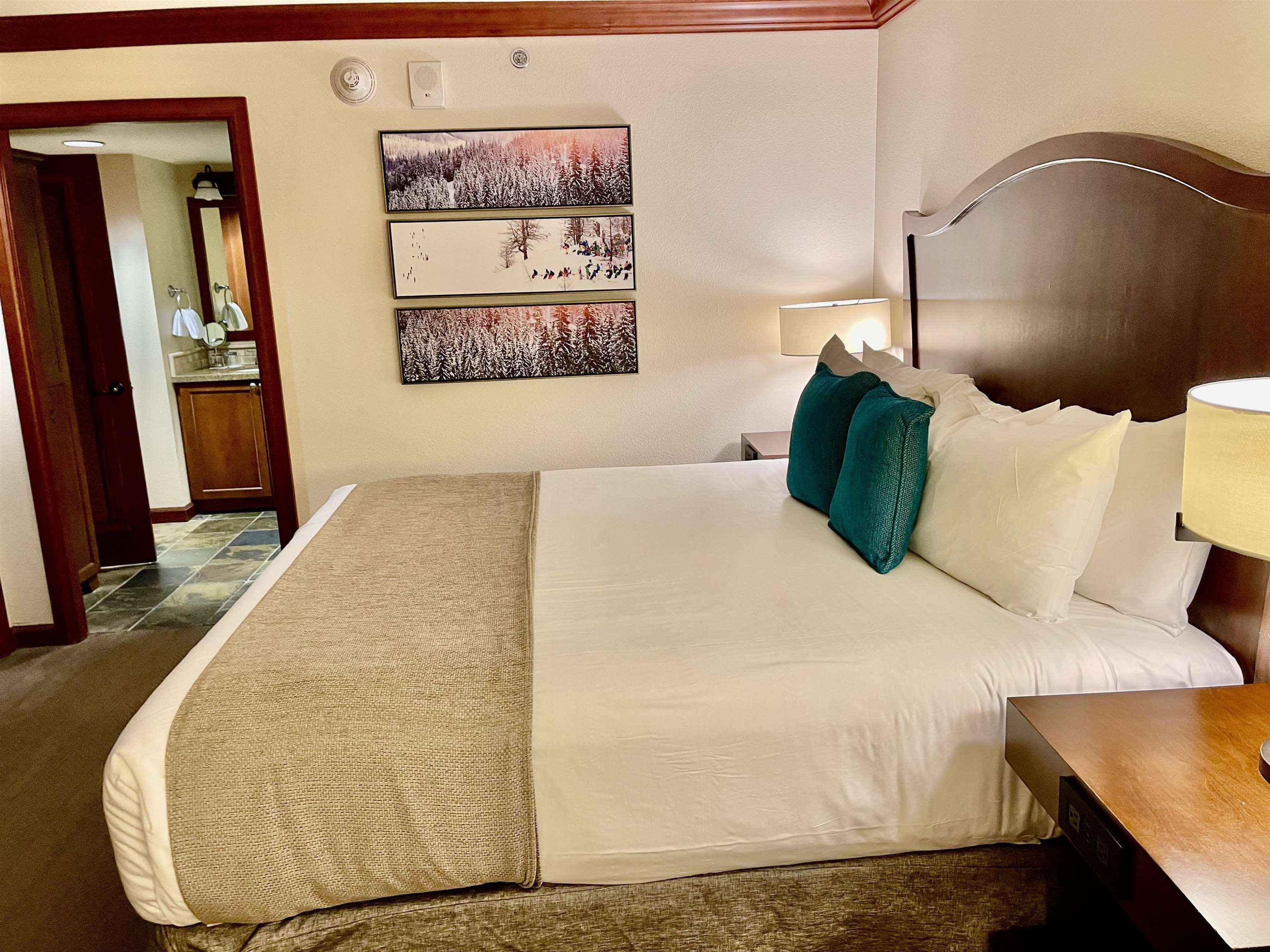 400 Resort Road, Unit 242 244 Olympic Valley, CA 96146 - Photo 11 of 28 a bed sitting in a bedroom and painting on the wall