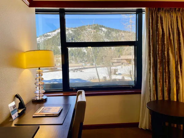 a view of a room with furniture and window