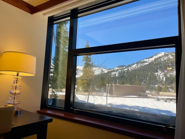 a view of a room with a large window