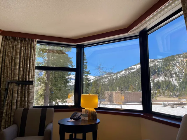 a view of a room with furniture and a window