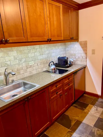 a kitchen with a sink and cabinets