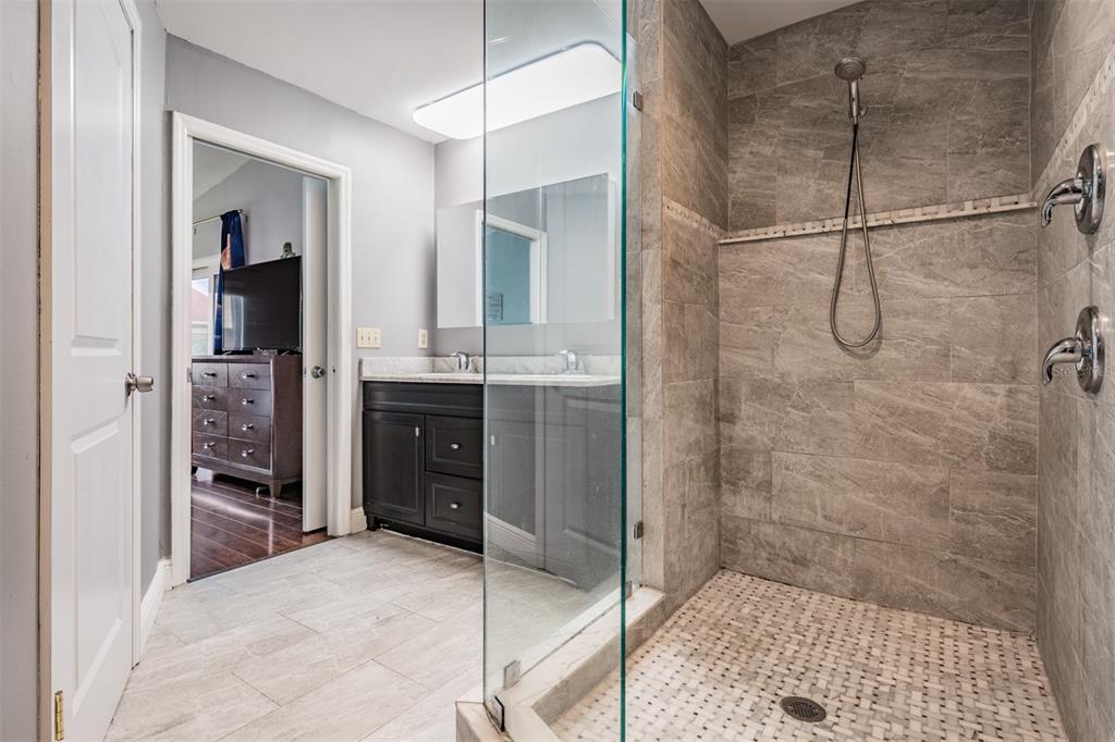 637 Drake Lane North Dunedin, FL 34698 - Photo 20 of 43 a bathroom with a shower and a sink