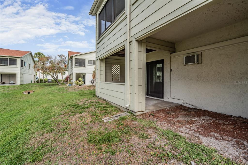637 Drake Lane North Dunedin, FL 34698 - Photo 30 of 43 a view of a house with a yard