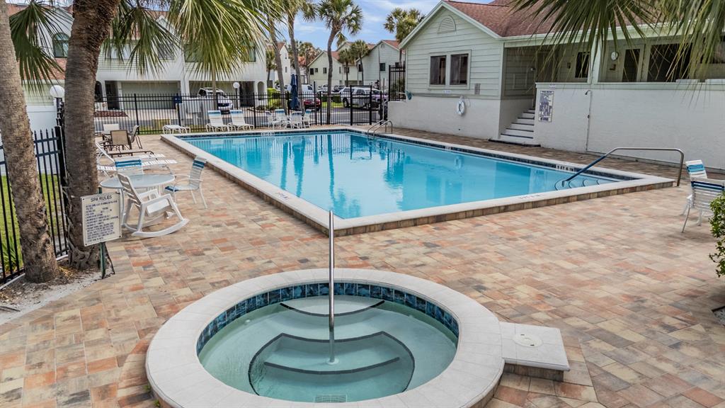 637 Drake Lane North Dunedin, FL 34698 - Photo 39 of 43 a swimming pool with outdoor seating yard and barbeque oven