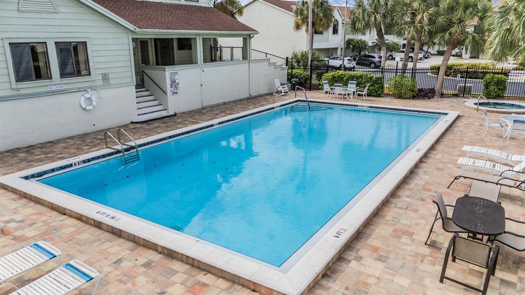 637 Drake Lane North Dunedin, FL 34698 - Photo 41 of 43 a view of a pool with chairs in patio
